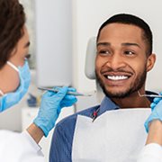 Dental patient smiling at dentist