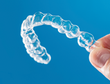 hand hold Invisalign tray