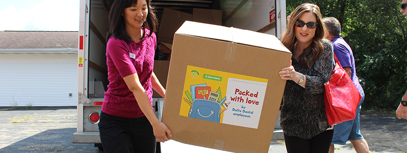 People carrying donation box