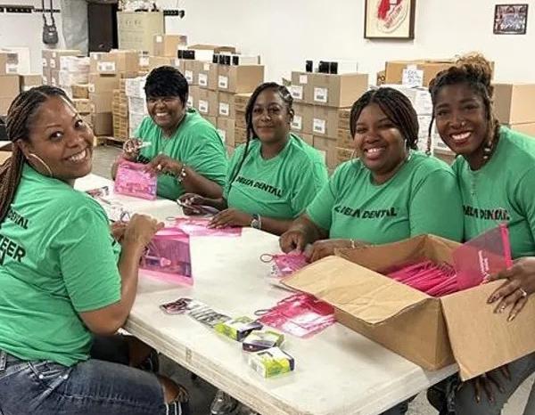Happy group of Delta Dental employees volunteering